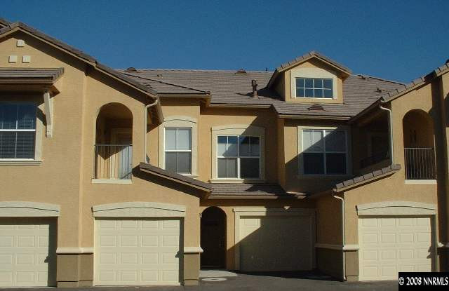 9050 Double R Boulevard, Unit 1222 Reno, NV 89521 - Photo 1 of 5 a front view of a house with a garage