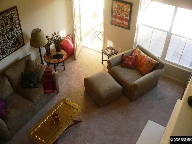 9050 Double R Boulevard, Unit 1222 Reno, NV 89521 - Photo 3 of 5 a living room with furniture and a window