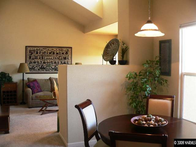 9050 Double R Boulevard, Unit 1222 Reno, NV 89521 - Photo 5 of 5 a lamp that has a table and chairs in it