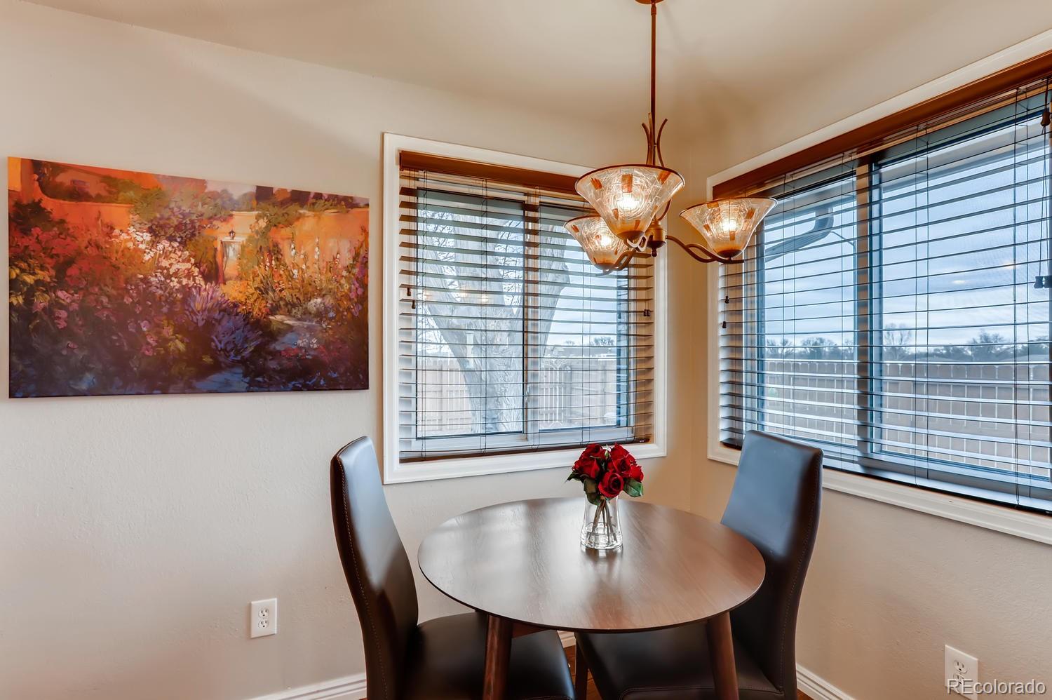 1502 Juniper Street Longmont, CO 80501 - Photo 12 of 28 a view of a dining room with furniture window and outside view