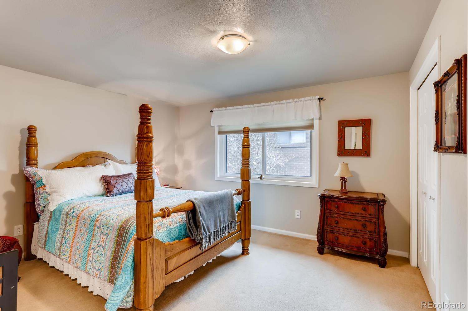 1502 Juniper Street Longmont, CO 80501 - Photo 19 of 28 a bedroom with two beds and window