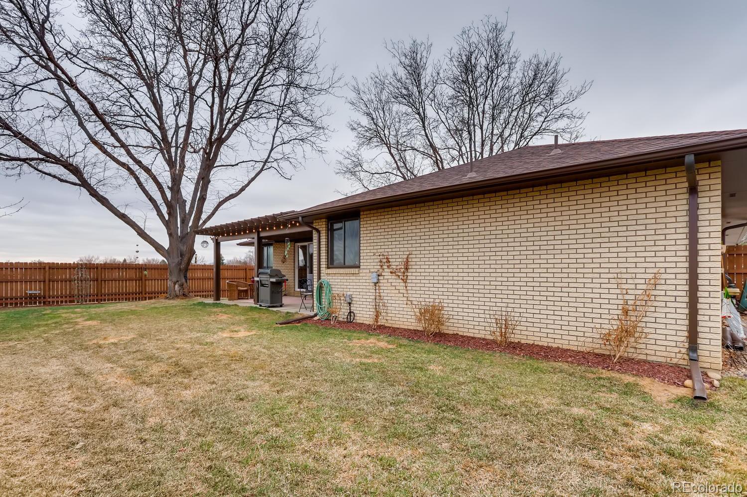 1502 Juniper Street Longmont, CO 80501 - Photo 27 of 28 a view of a house with a backyard