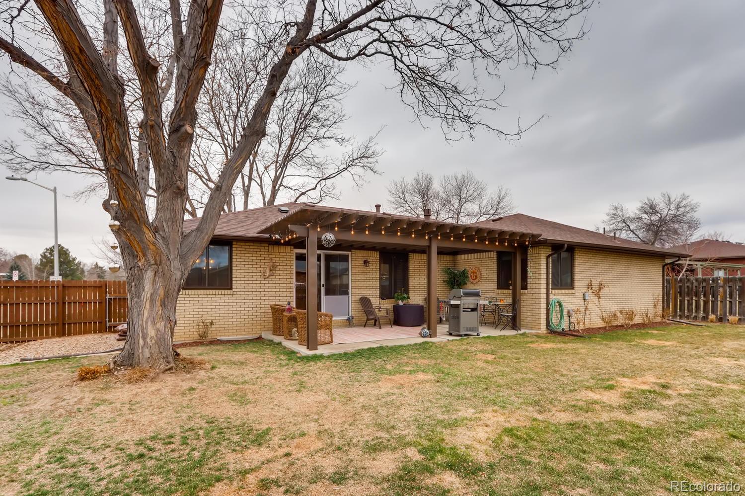 1502 Juniper Street Longmont, CO 80501 - Photo 28 of 28 a front view of a house with patio