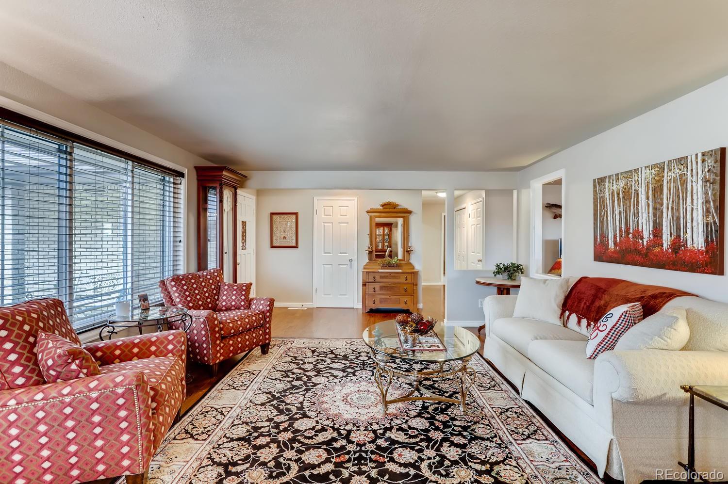 1502 Juniper Street Longmont, CO 80501 - Photo 6 of 28 a living room with furniture and a couch