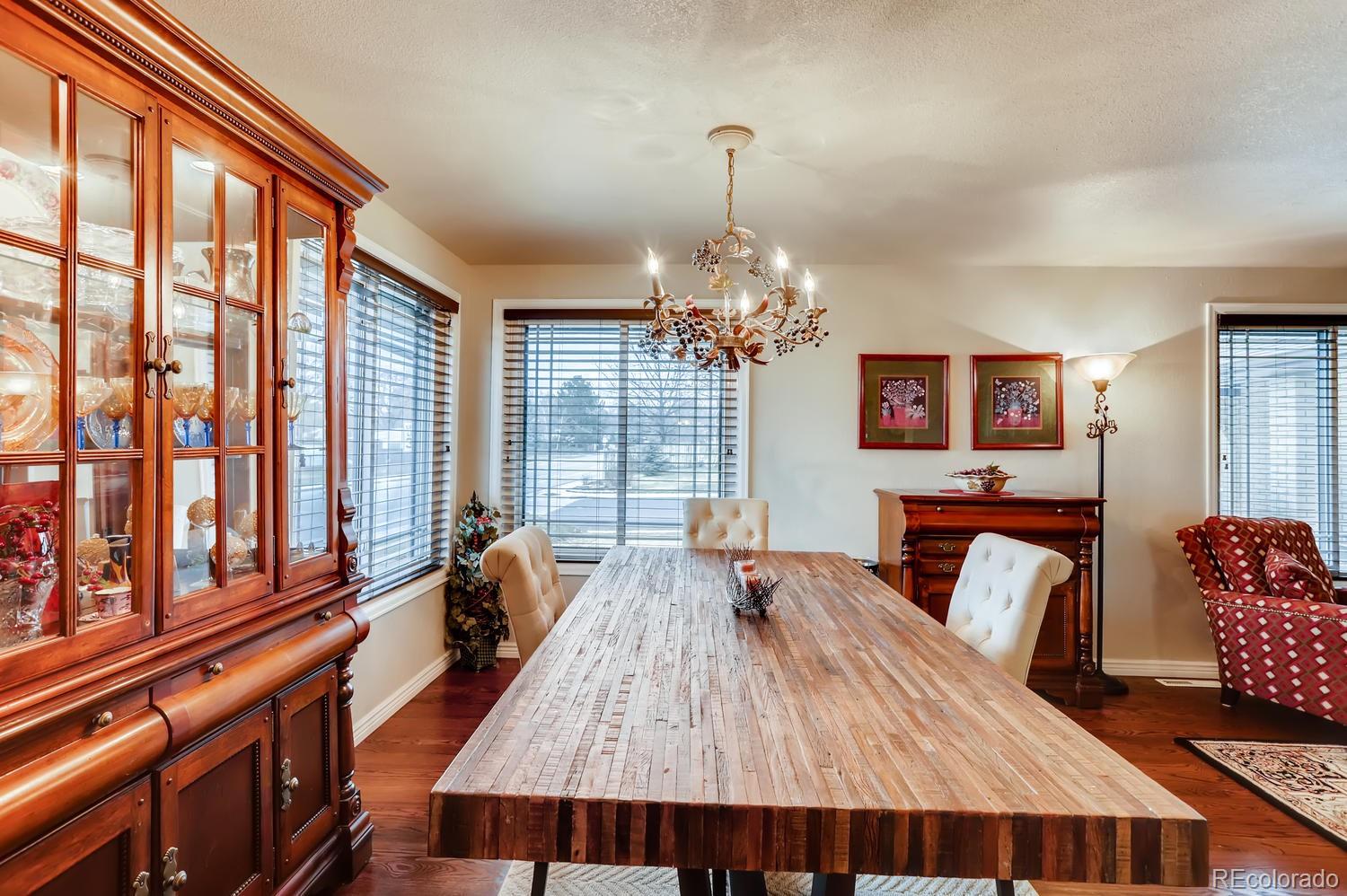 1502 Juniper Street Longmont, CO 80501 - Photo 7 of 28 a living room with furniture and a chandelier