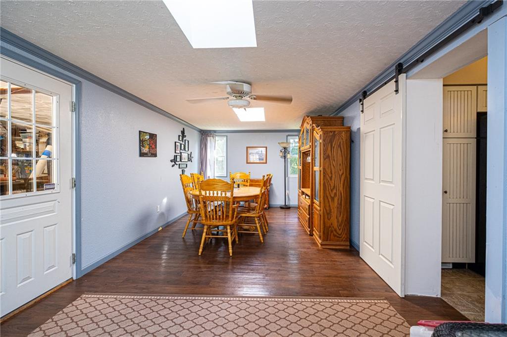 265 Walton Road Baldwin, PA 15236 - Photo 4 of 25 Huge Dining Room with 2 skylights. Gorgeous barn door added that slides