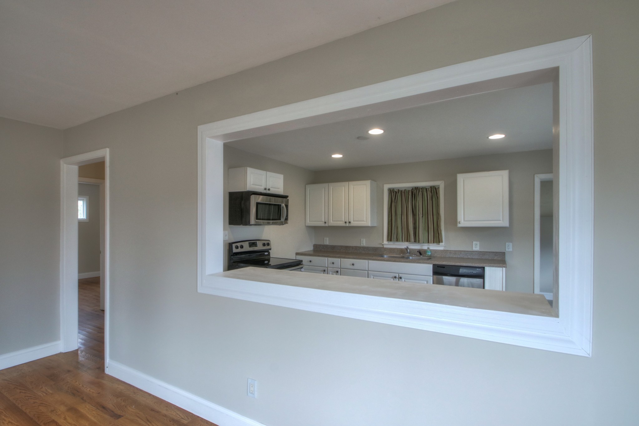 3885 Kedron Road Spring Hill, TN 37174 - Photo 2 of 32 a view of a kitchen with kitchen island a sink stainless steel appliances and cabinets