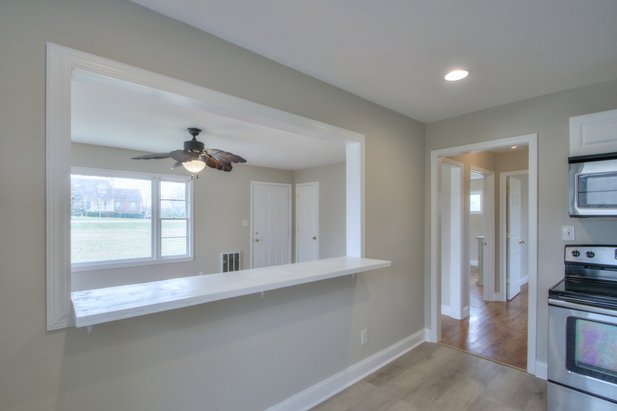 3885 Kedron Road Spring Hill, TN 37174 - Photo 11 of 32 a view of a kitchen with a sink cabinet a fireplace and windows