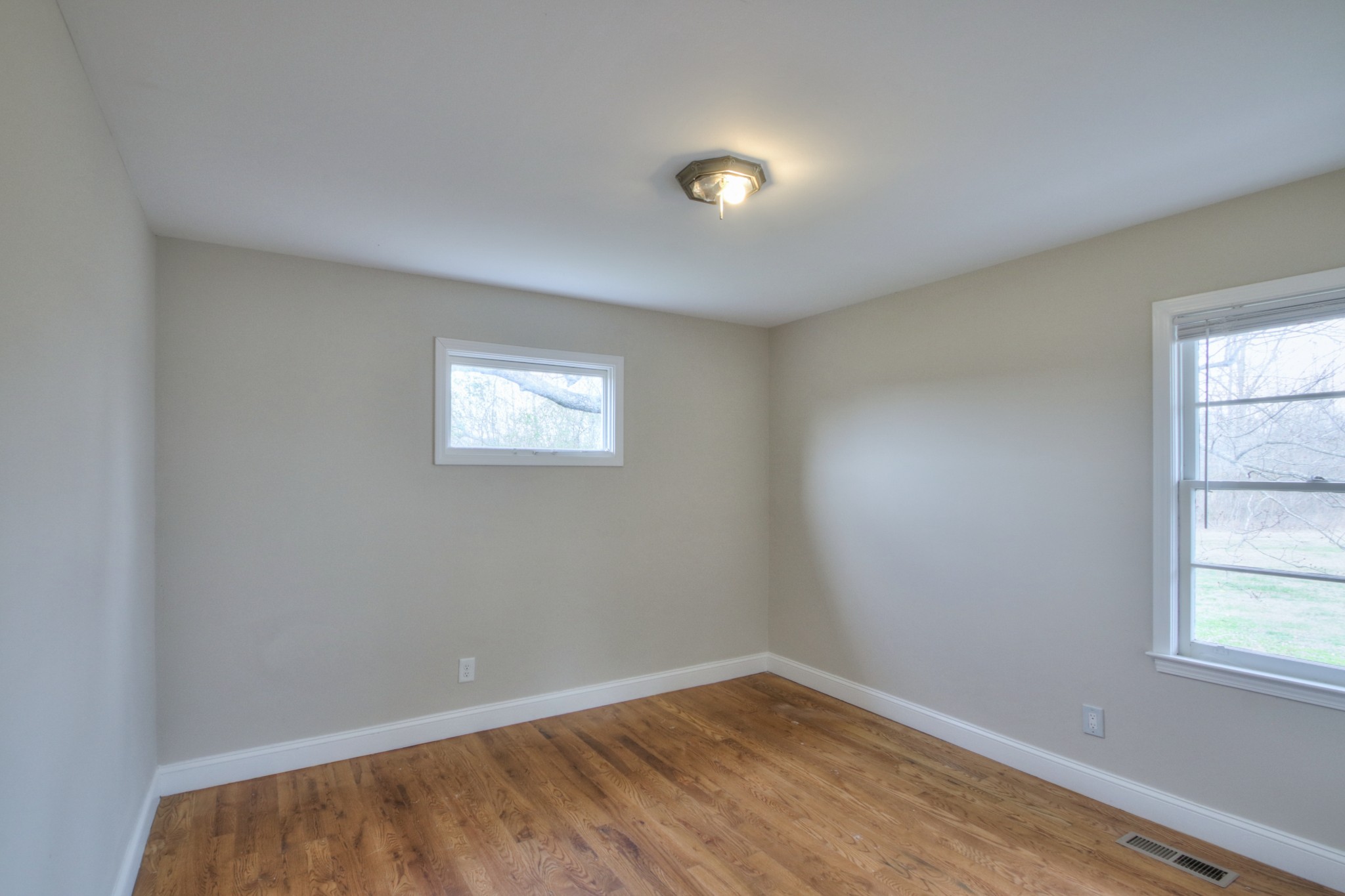 3885 Kedron Road Spring Hill, TN 37174 - Photo 13 of 32 an empty room with wooden floor and windows