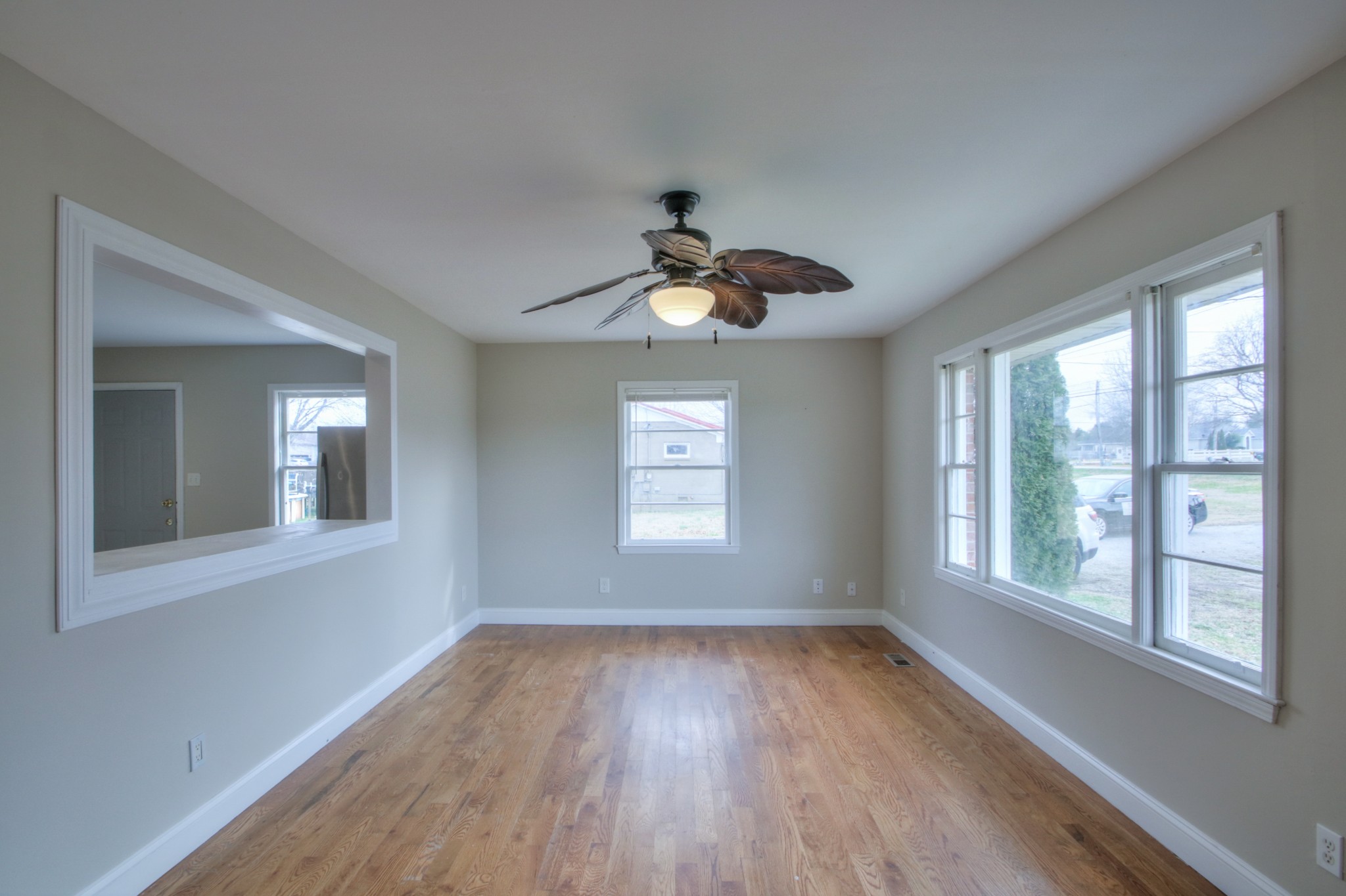 3885 Kedron Road Spring Hill, TN 37174 - Photo 18 of 32 a view of an empty room with wooden floor and a window