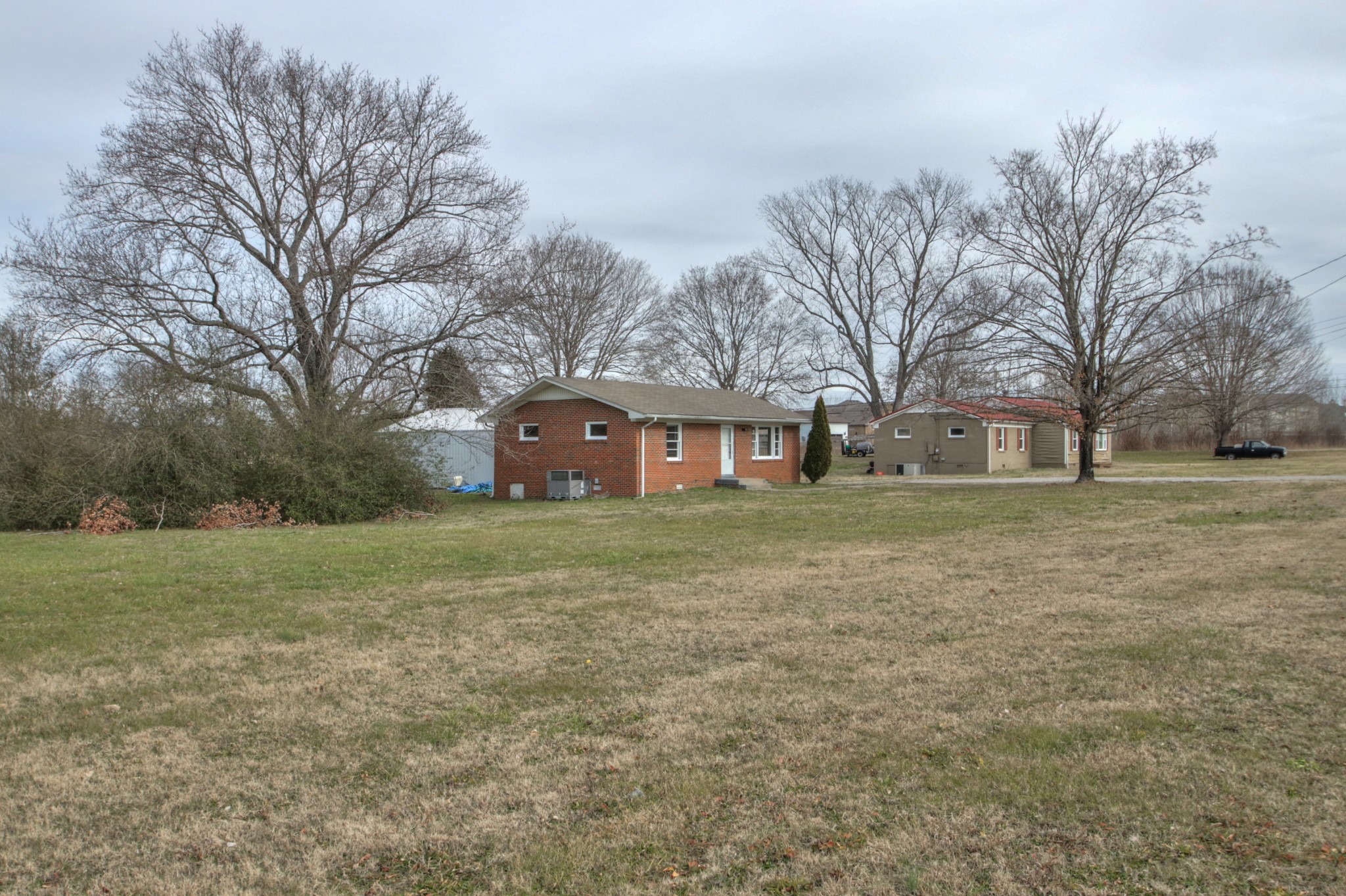 3885 Kedron Road Spring Hill, TN 37174 - Photo 3 of 32 a front view of house with yard and trees