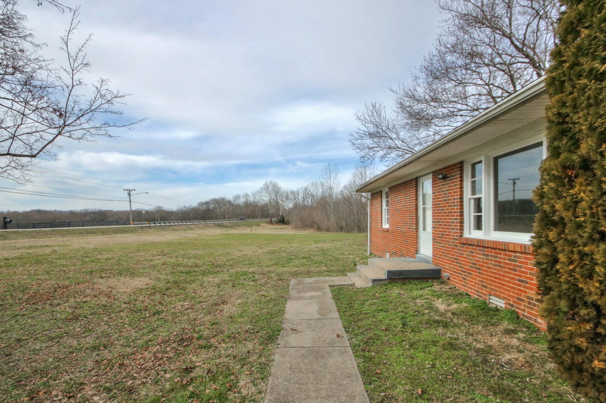 3885 Kedron Road Spring Hill, TN 37174 - Photo 28 of 32 a backyard of a house with lots of green space