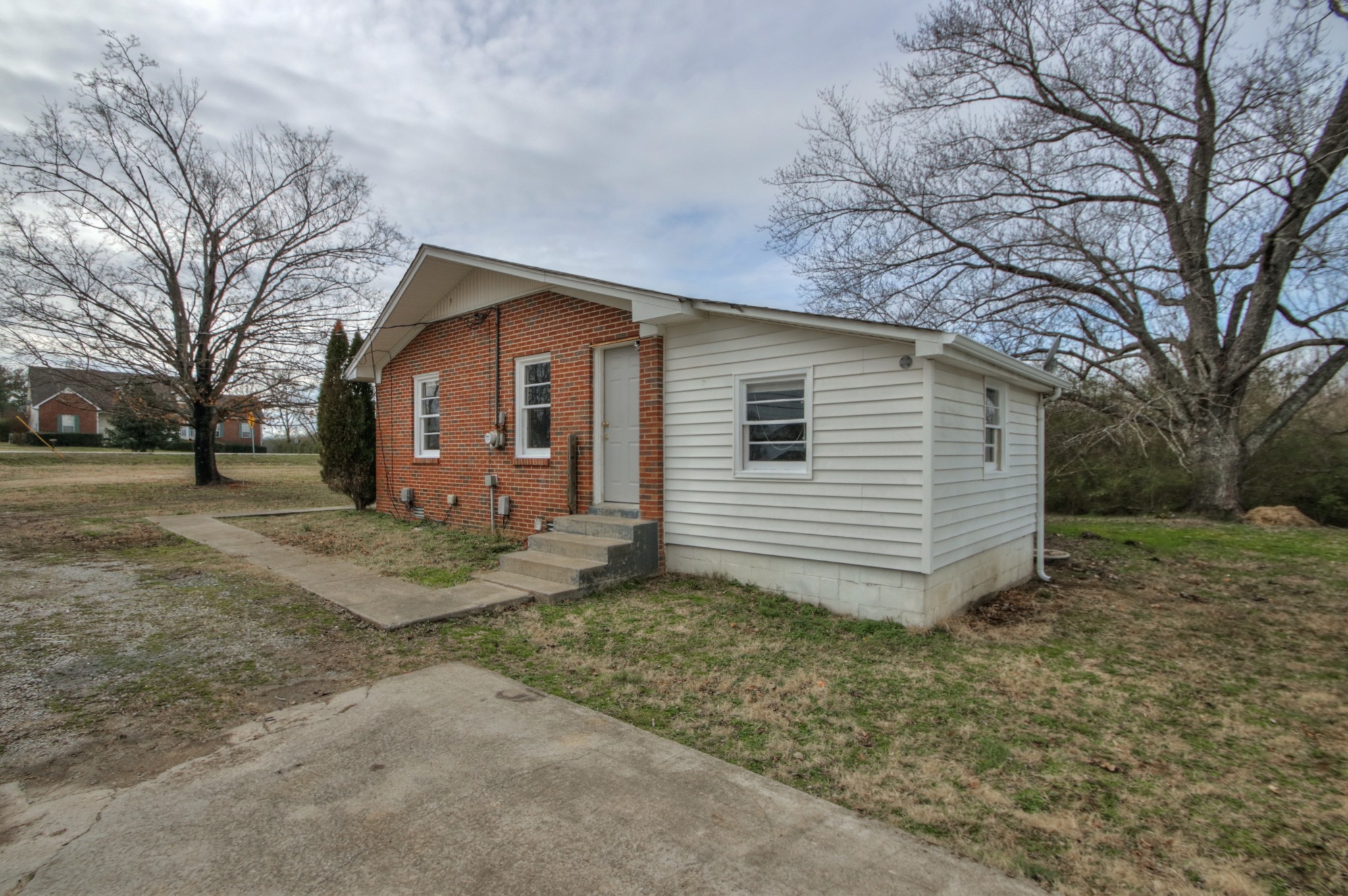 3885 Kedron Road Spring Hill, TN 37174 - Photo 29 of 32 a view of a house with a yard and large tree