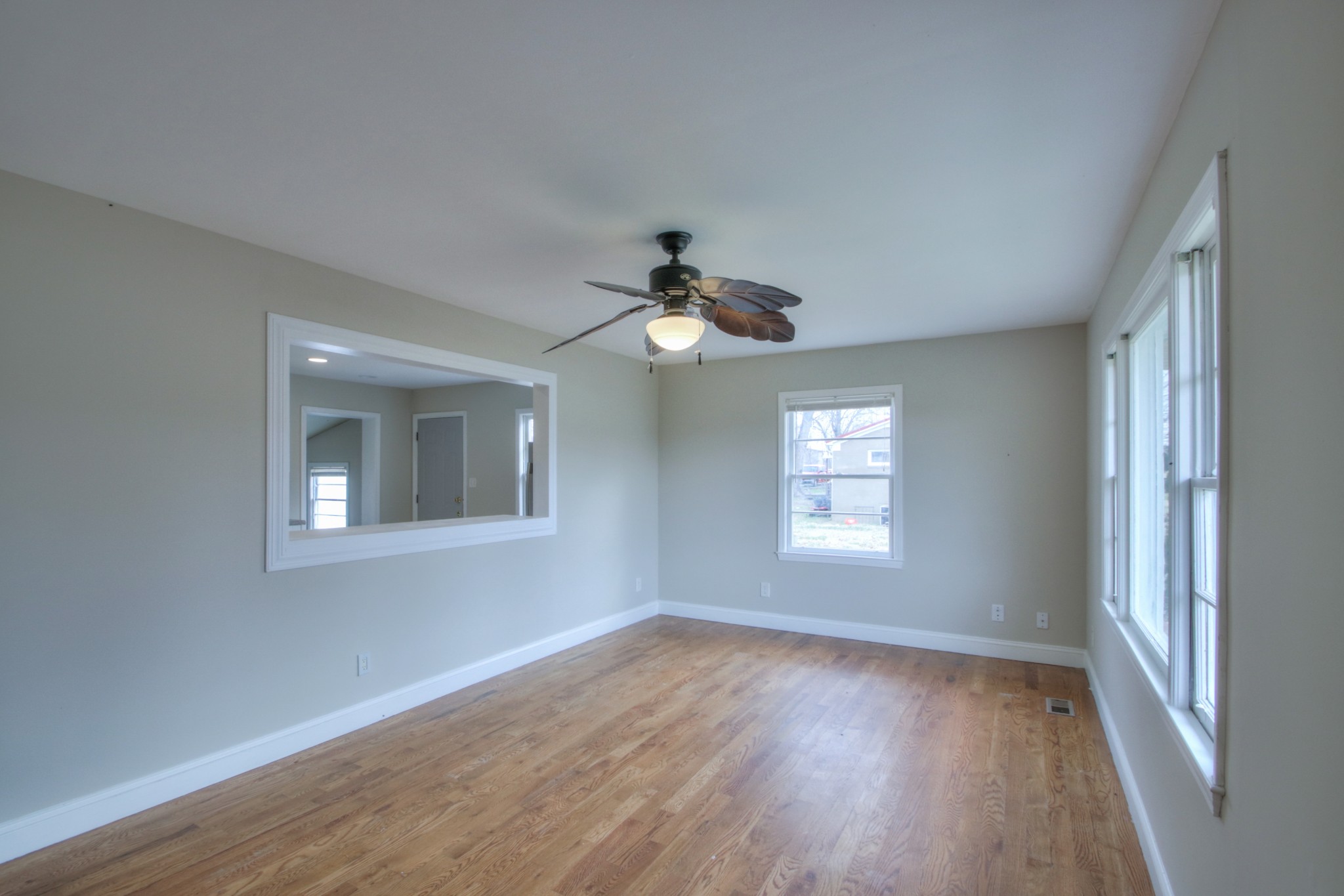 3885 Kedron Road Spring Hill, TN 37174 - Photo 9 of 32 a view of an empty room with wooden floor and a window
