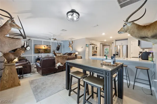 a view of a livingroom with furniture and a flat screen tv