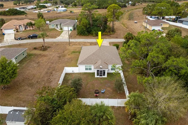an aerial view of a house with swimming pool
