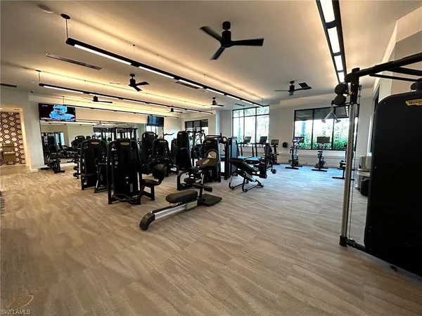 a view of swimming pool with a garden and seating