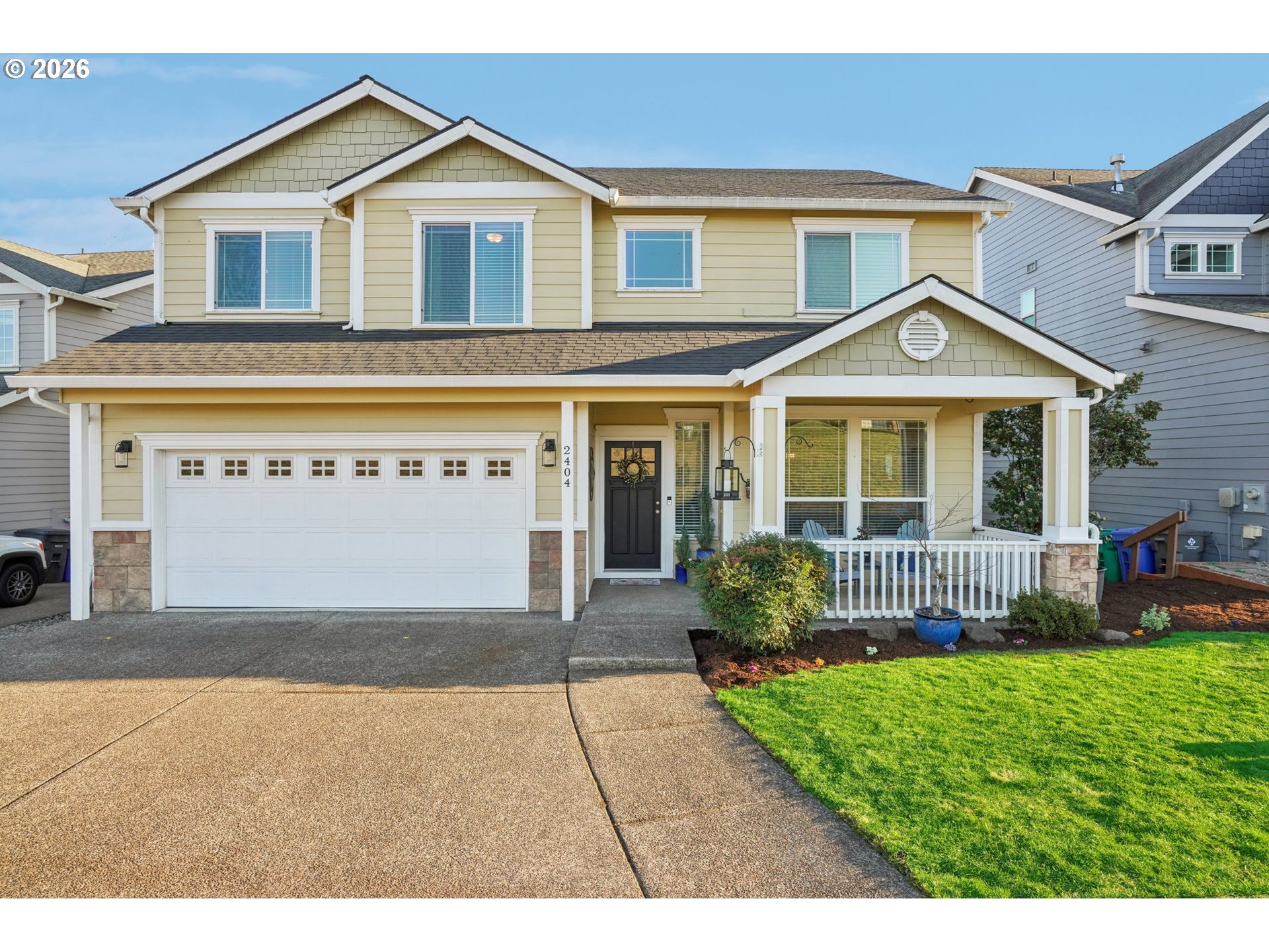 2404 Southeast Jasmine Way Gresham, OR 97080 - Photo 1 of 48 a front view of a house with a yard and porch