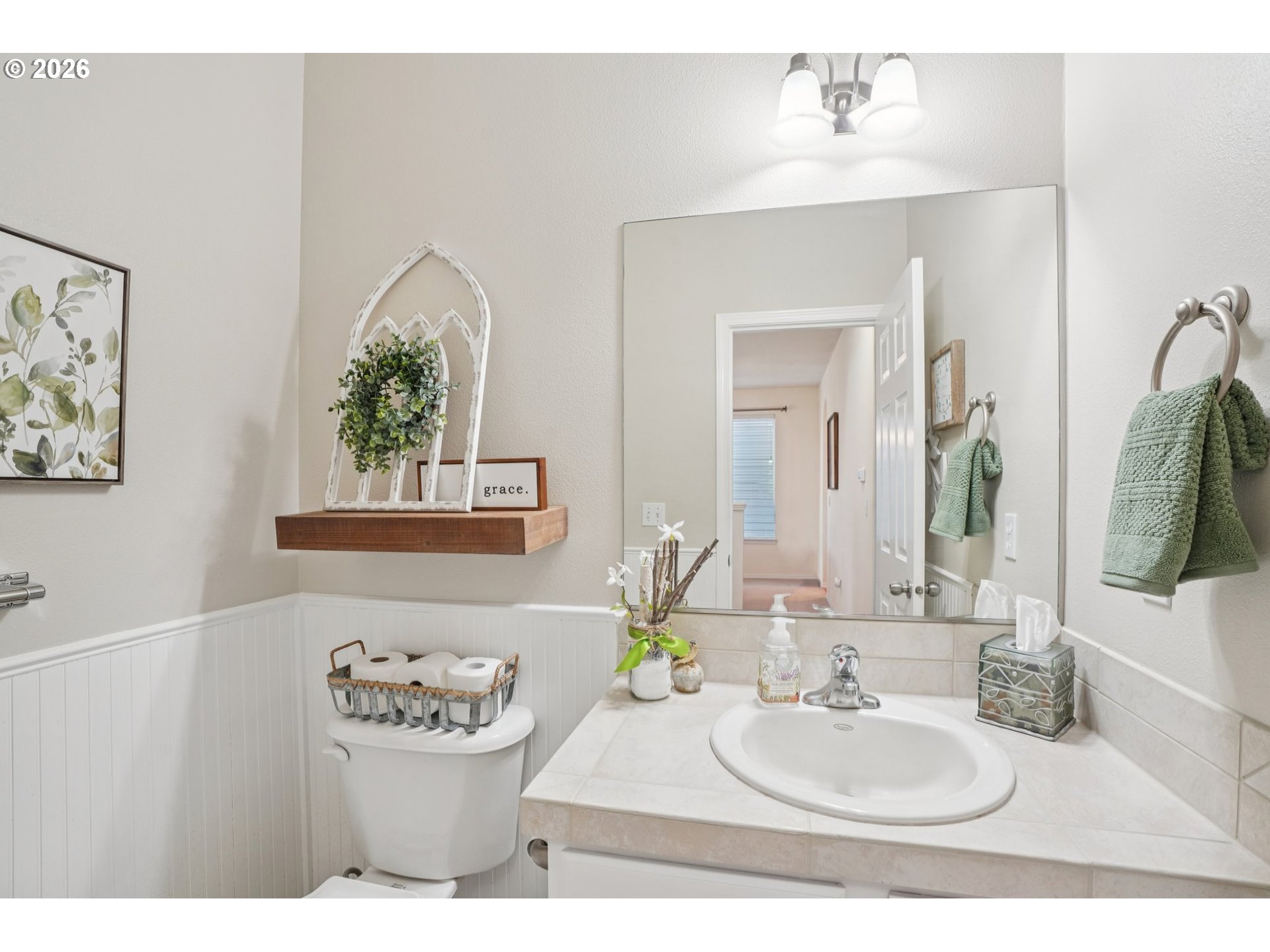 2404 Southeast Jasmine Way Gresham, OR 97080 - Photo 13 of 48 a bathroom with a sink and a mirror