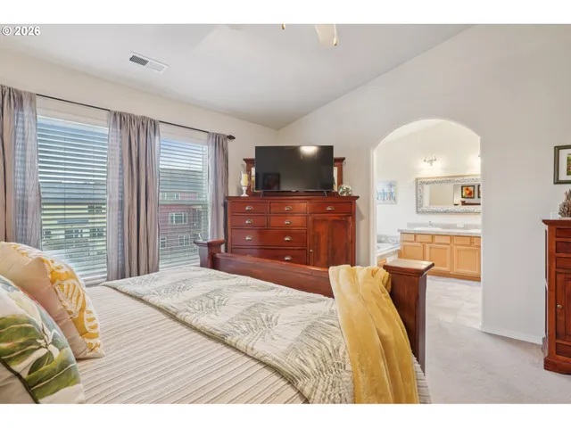 a bathroom with a granite countertop sink mirror toilet and bathtub