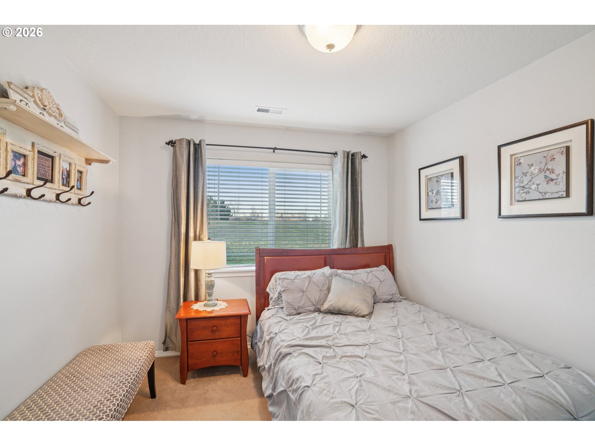 2404 Southeast Jasmine Way Gresham, OR 97080 - Photo 27 of 48 a bedroom with a bed and a large window