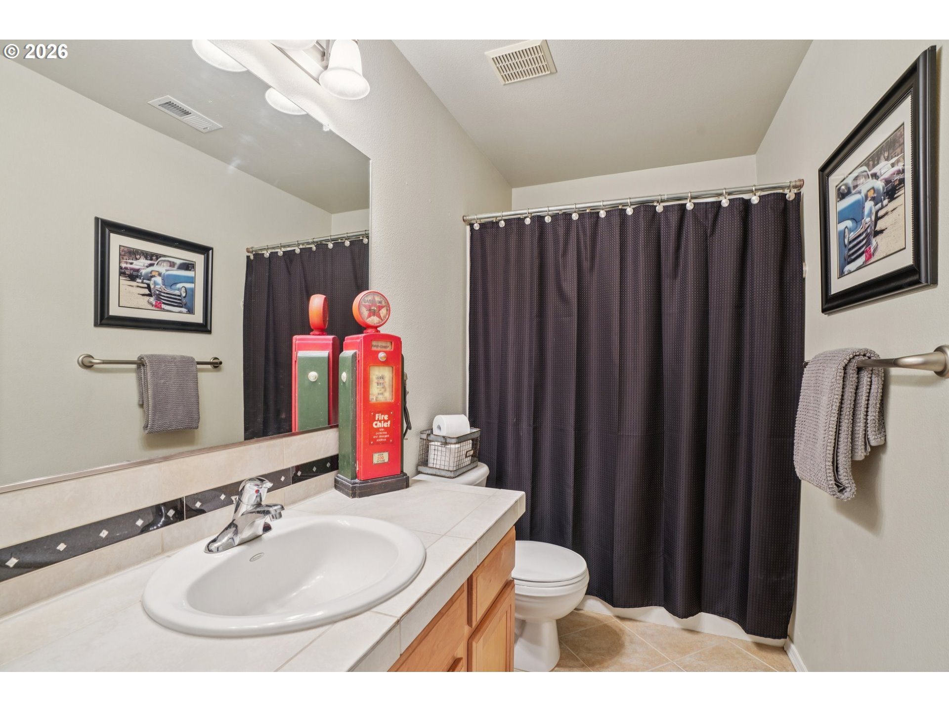 2404 Southeast Jasmine Way Gresham, OR 97080 - Photo 29 of 48 a bathroom with a sink vanity mirror and toilet