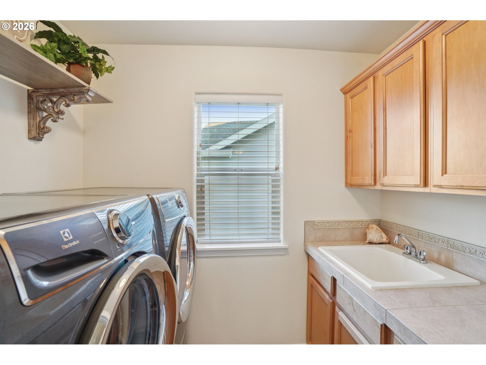 2404 Southeast Jasmine Way Gresham, OR 97080 - Photo 30 of 48 a bathroom with a sink and a mirror