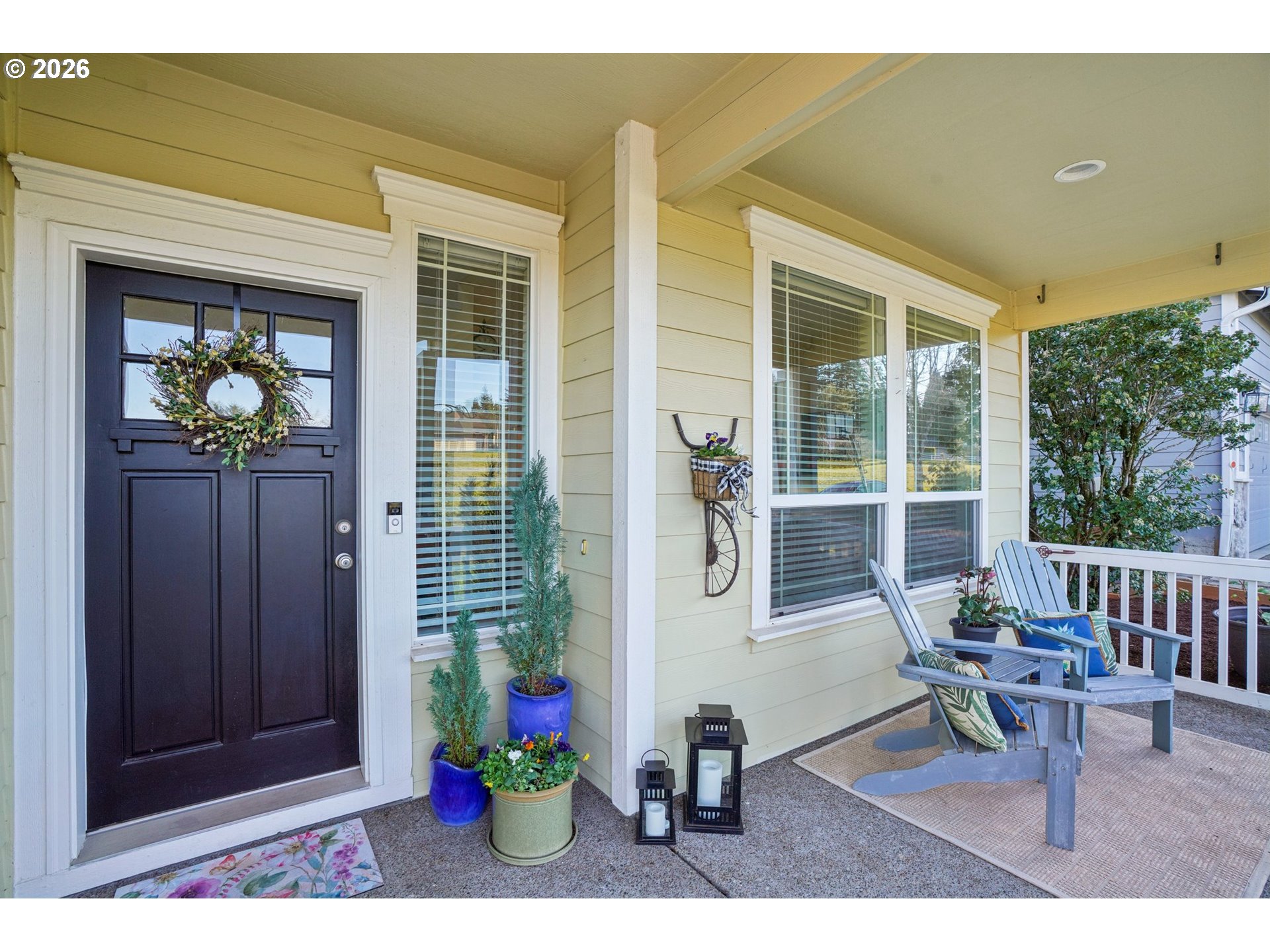 2404 Southeast Jasmine Way Gresham, OR 97080 - Photo 3 of 48 a view of a porch with chairs and potted plants
