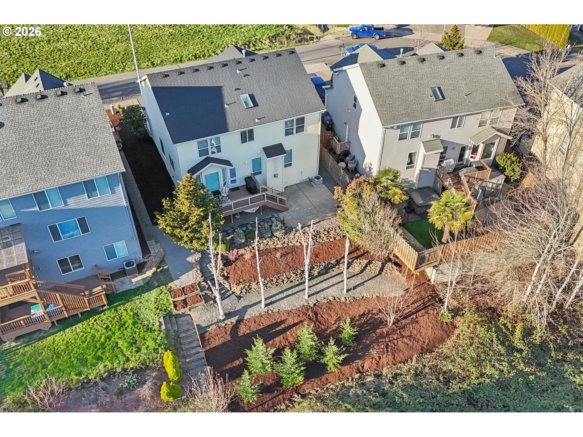2404 Southeast Jasmine Way Gresham, OR 97080 - Photo 44 of 48 an aerial view of a house with a yard and a large tree