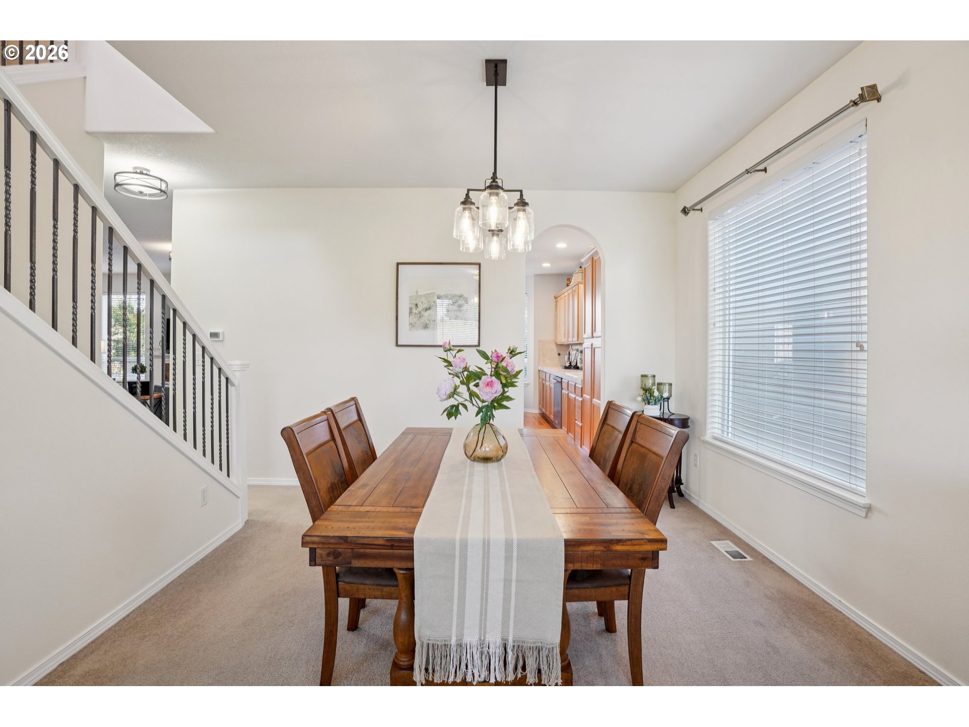 2404 Southeast Jasmine Way Gresham, OR 97080 - Photo 6 of 48 a view of a dining room with furniture and wooden floor