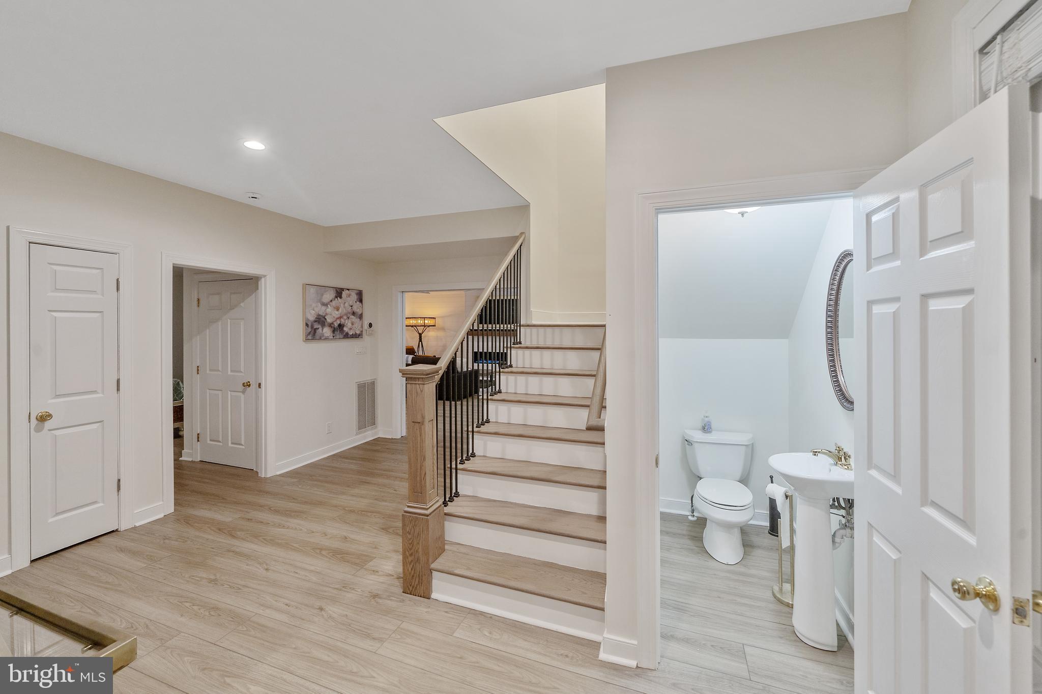 13023 North Shore Road Ocean City, MD 21842 - Photo 36 of 62 Main Level Powder Room 2 of 2 & Rear Staircase