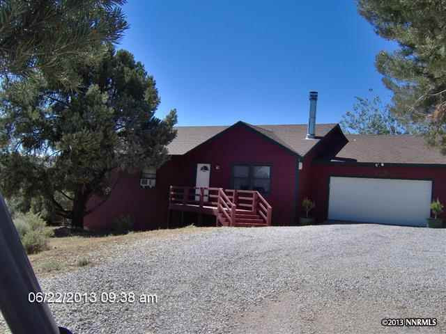 1990 Empire Road Reno, NV 89521 - Photo 1 of 1 a front view of a house with a yard