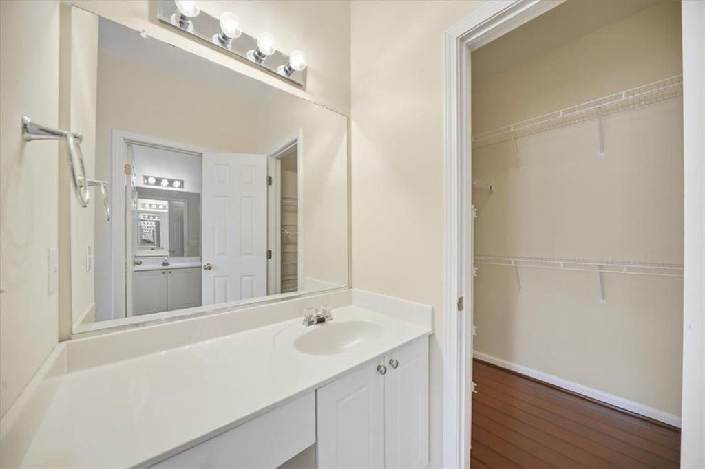 111 Stonegate Lane Canton, GA 30114 - Photo 16 of 30 a bathroom with a sink and a mirror