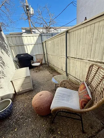 a living room with furniture and a rug