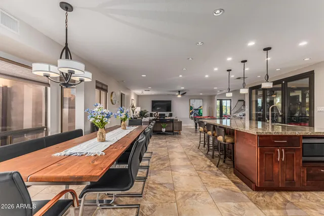 a living room with a bed furniture and a window