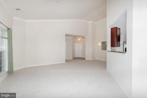 a view of a big room with windows and cabinet