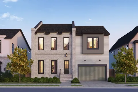 a front view of a house with a yard garage and garage
