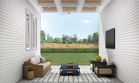 a view of a patio with couches chairs and a yard