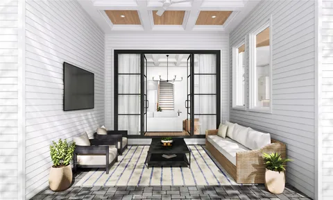 a living room filled with furniture and a flat screen tv