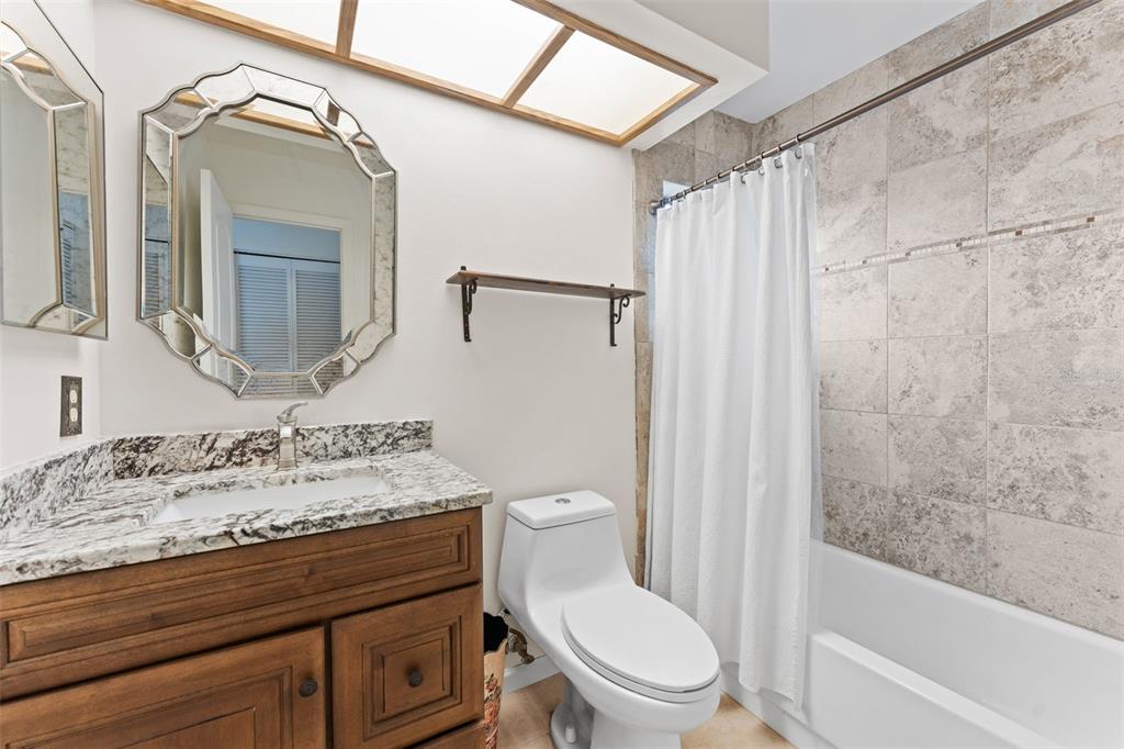 250 Woods Landing Trail Oldsmar, FL 34677 - Photo 17 of 45 a bathroom with a sink a toilet and shower