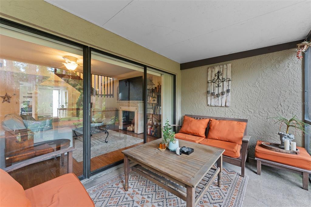 250 Woods Landing Trail Oldsmar, FL 34677 - Photo 21 of 45 a outdoor living space with furniture and a flat screen tv