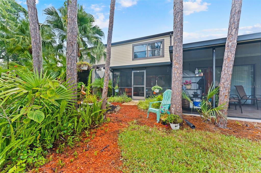 250 Woods Landing Trail Oldsmar, FL 34677 - Photo 23 of 45 a backyard of a house with yard and outdoor seating