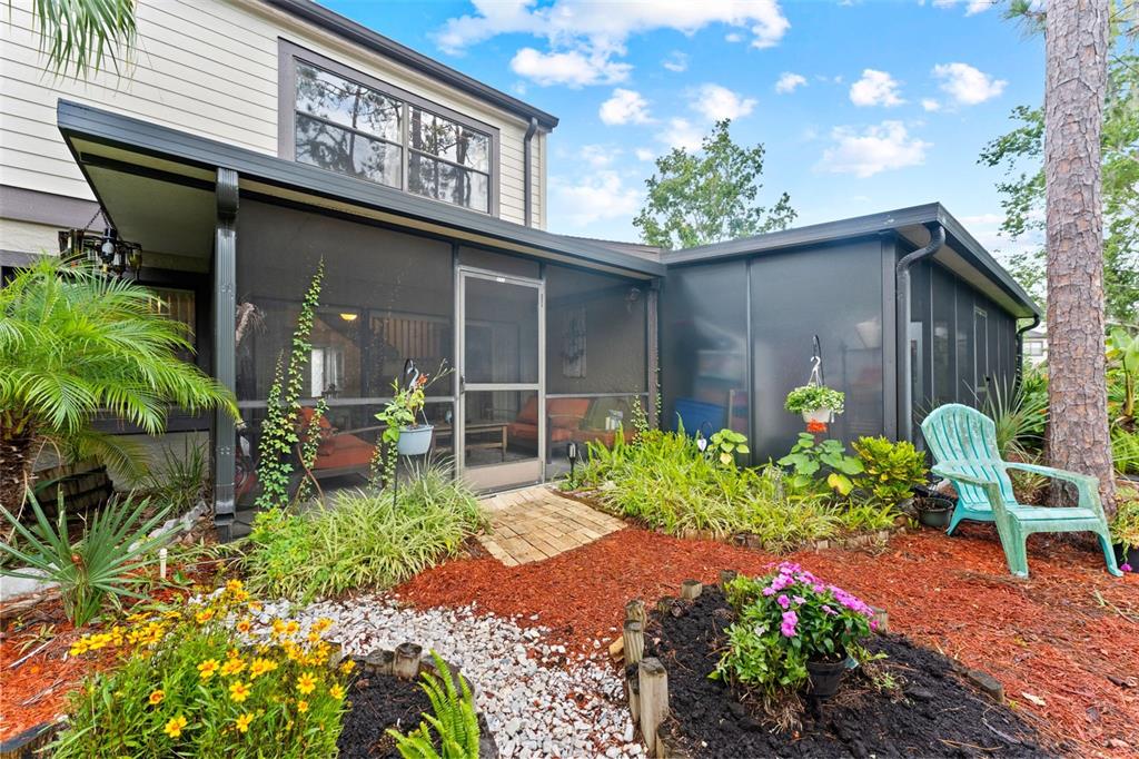 250 Woods Landing Trail Oldsmar, FL 34677 - Photo 24 of 45 a flower is in front of a house