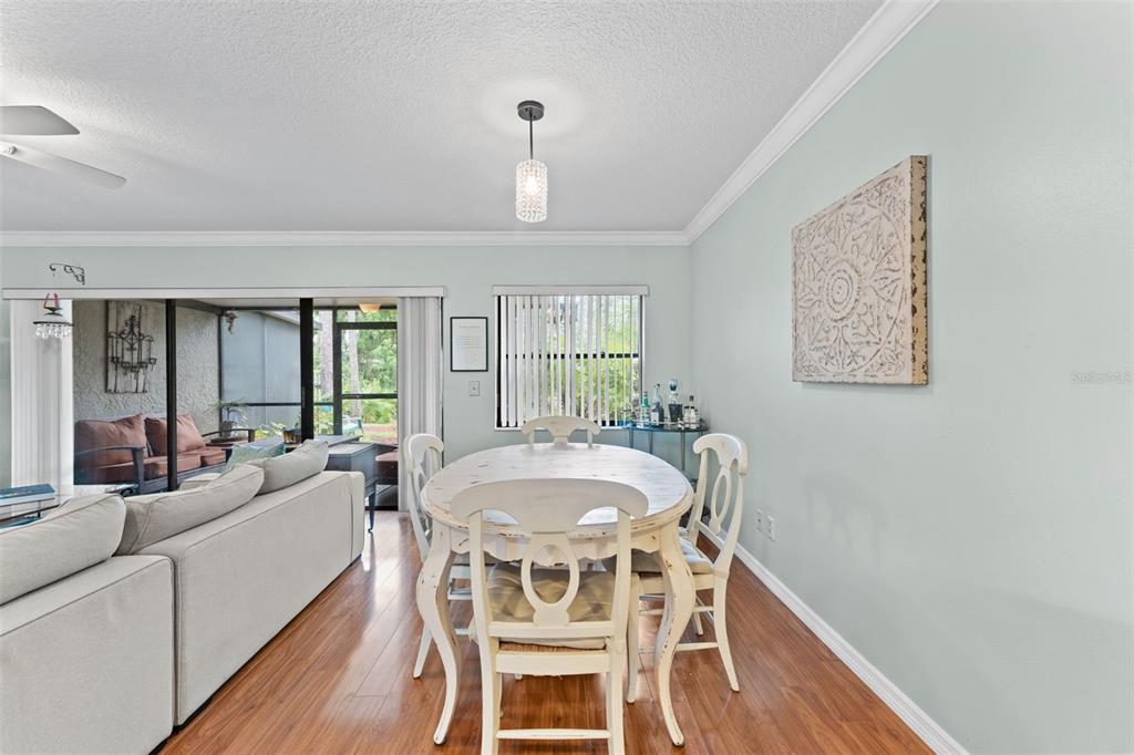 250 Woods Landing Trail Oldsmar, FL 34677 - Photo 7 of 45 a view of a dining room with furniture window and wooden floor