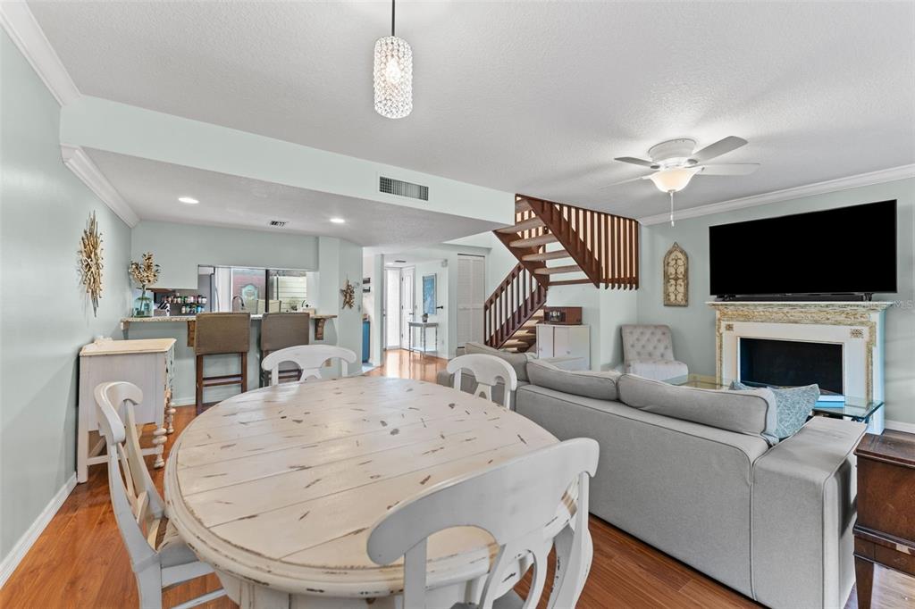 250 Woods Landing Trail Oldsmar, FL 34677 - Photo 8 of 45 a living room with furniture a fireplace and a flat screen tv