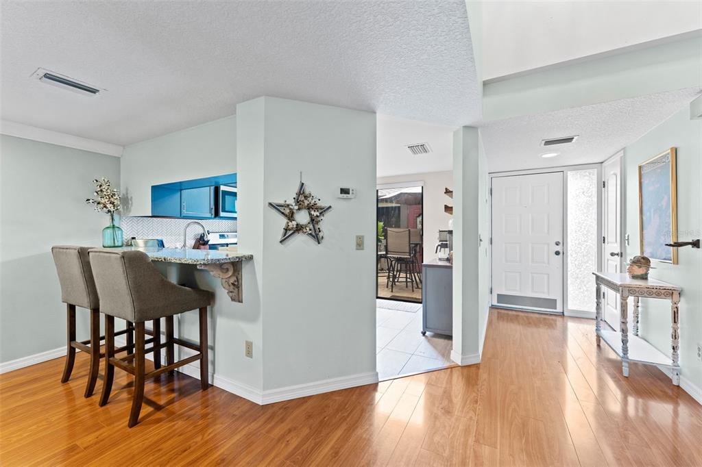 250 Woods Landing Trail Oldsmar, FL 34677 - Photo 9 of 45 a view of a dining room with furniture and wooden floor