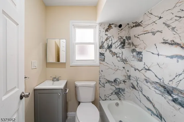 a bathroom with a toilet and a sink