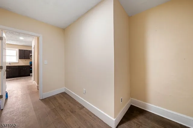 wooden floor and cabinet in an empty room