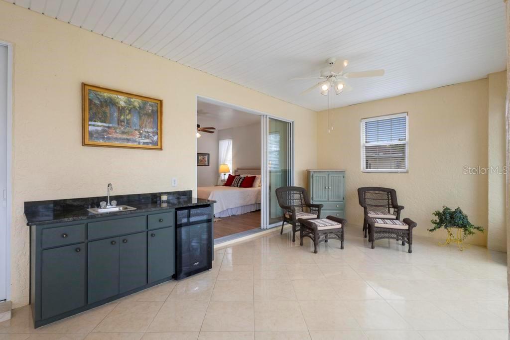 11767 Southeast 176th Place Road Summerfield, FL 34491 - Photo 29 of 37 LANAI with CABINET BAR, SINK and WINE COOLER