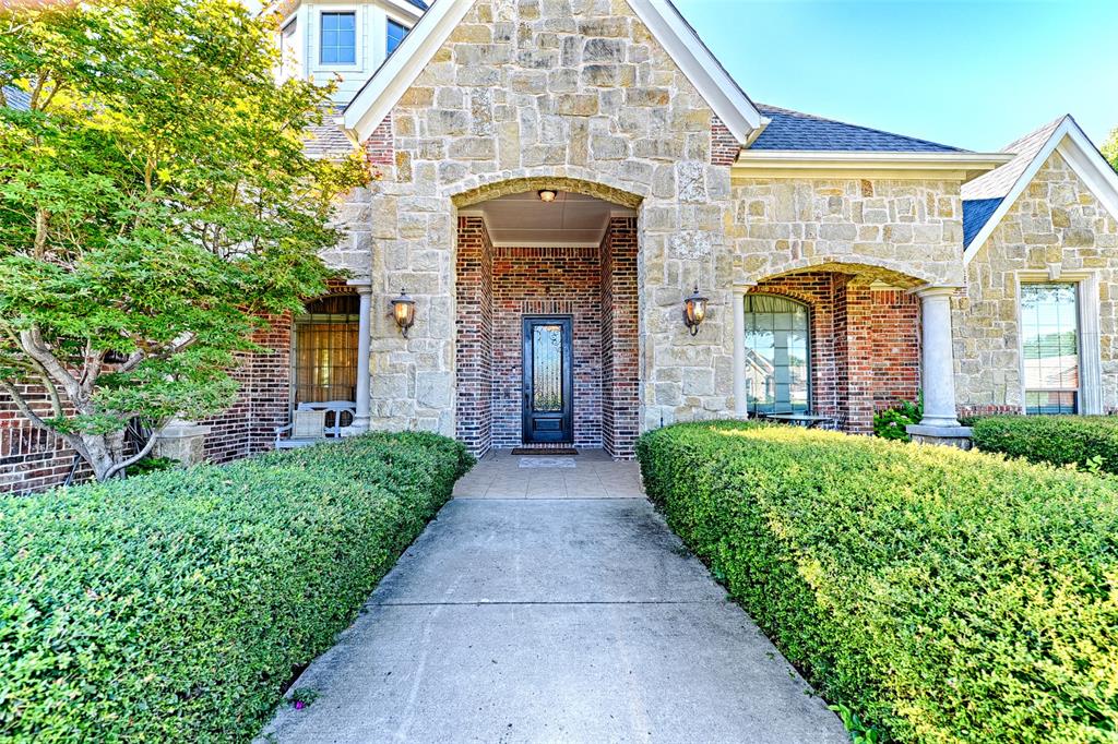 6806 Sawmill Road Dallas, TX 75252 - Photo 1 of 1 a front view of a house with garden